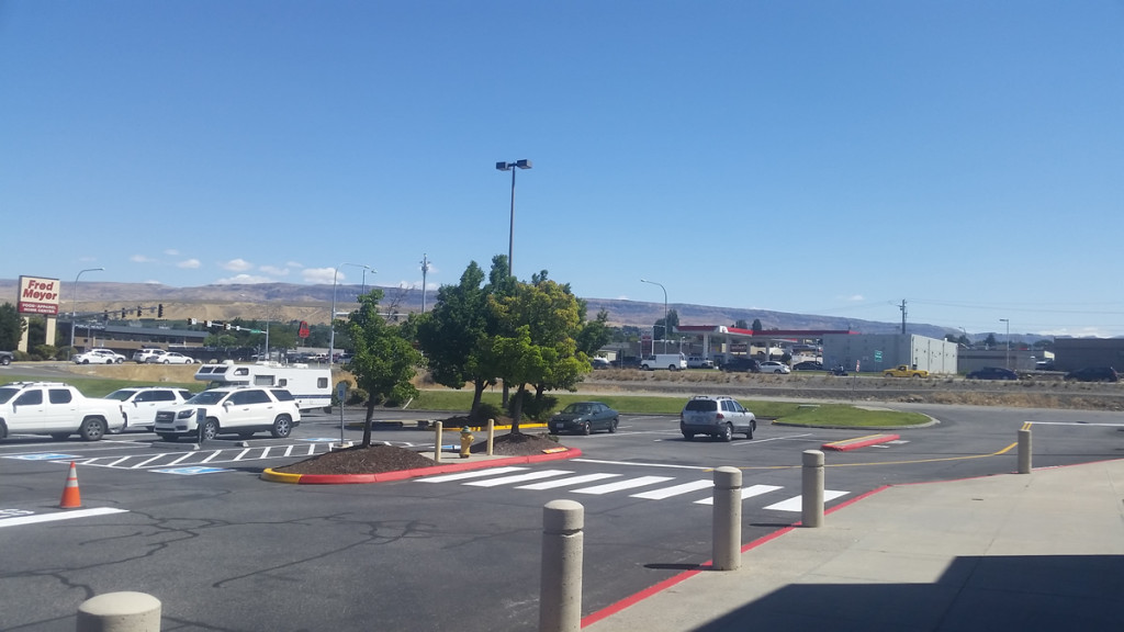 A parking lot with cars parked in it.