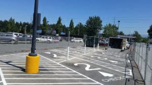 A parking lot with many lines painted on it