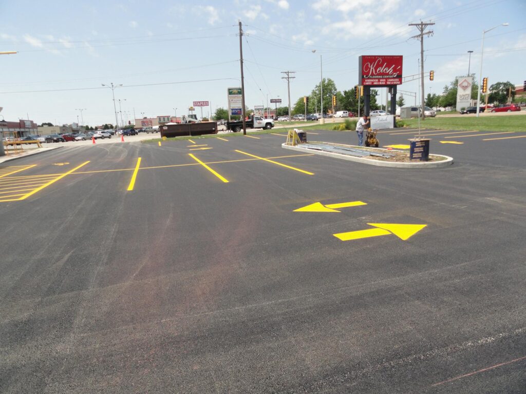 Yellow arrows on a parking lot.