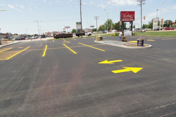 Yellow arrows on a parking lot.